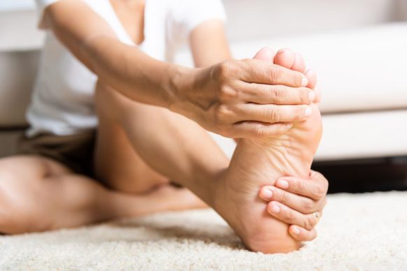 Woman stretching legs and feet