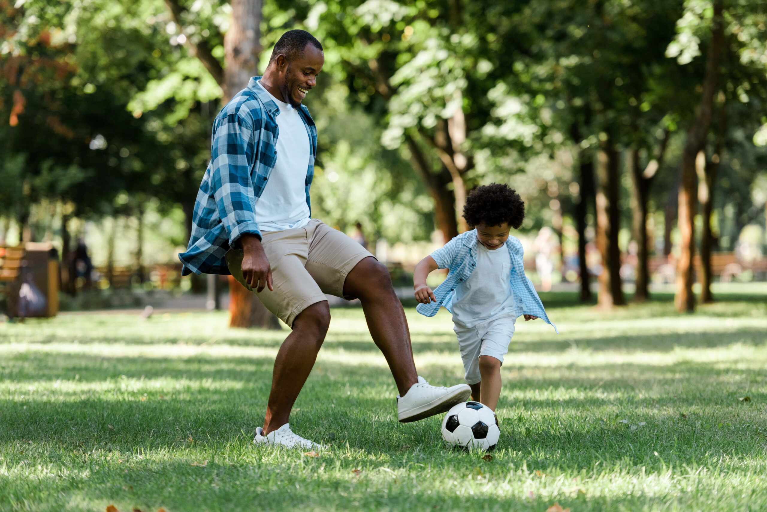 Father Playing Soccer with Son