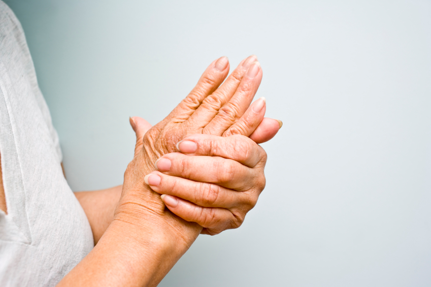 Older woman holding wrist